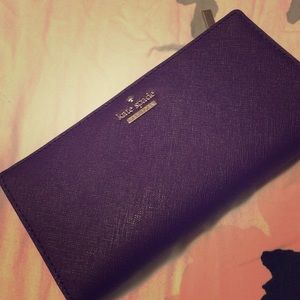 Purple colored kate spade wallet